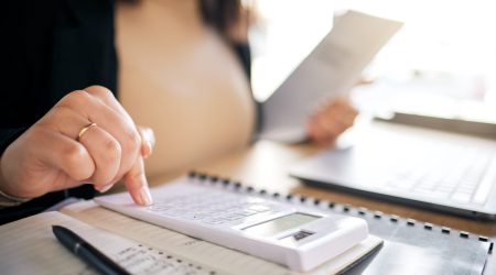 hands-calculator-and-accountant-working-with-docu-2025-04-06-07-15-57-utc Hands, calculator and accountant working with documents, financial report or analysis of audit, tax.